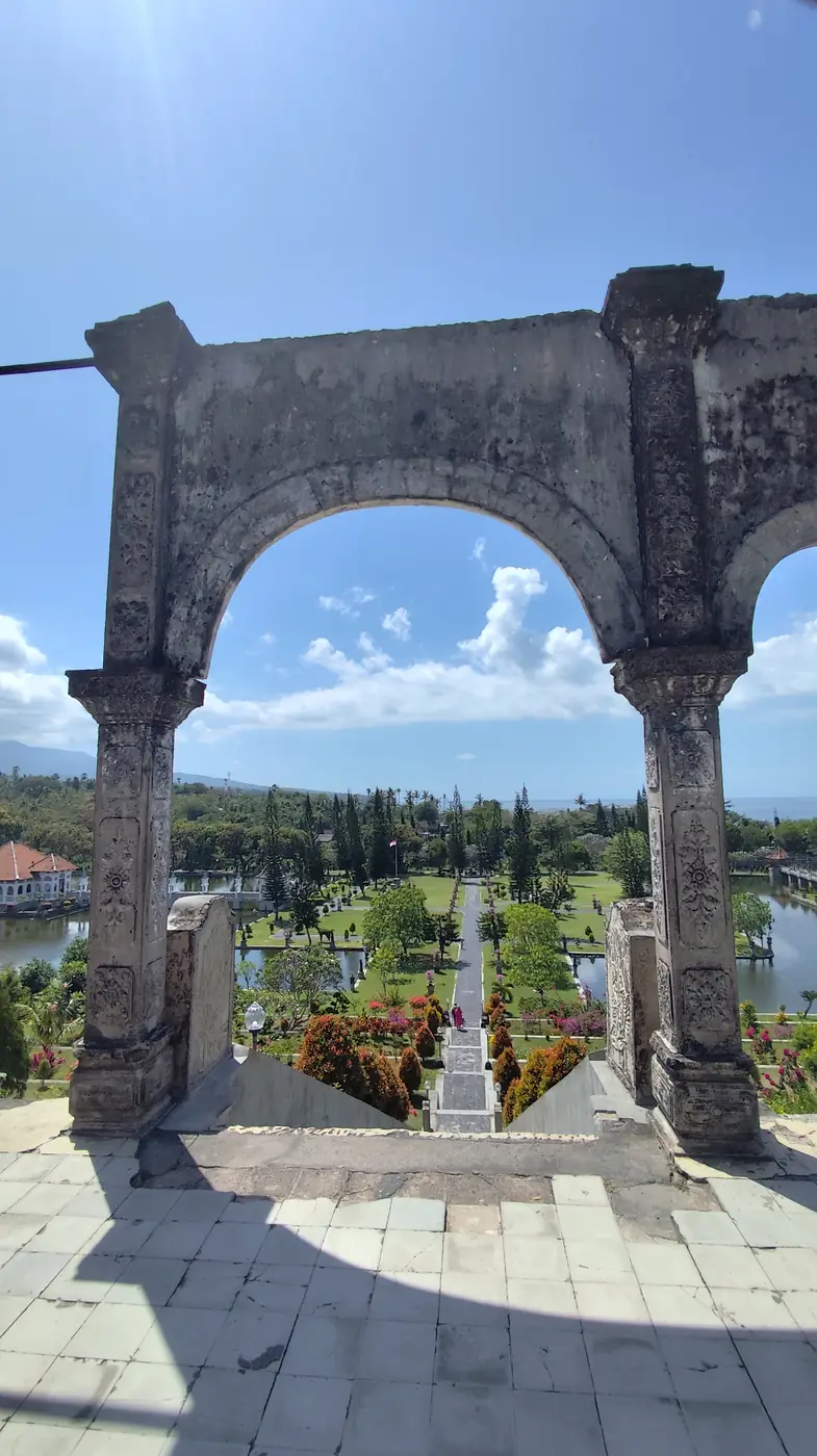 View from the archway over Taman Ujung's gardens toward the sea